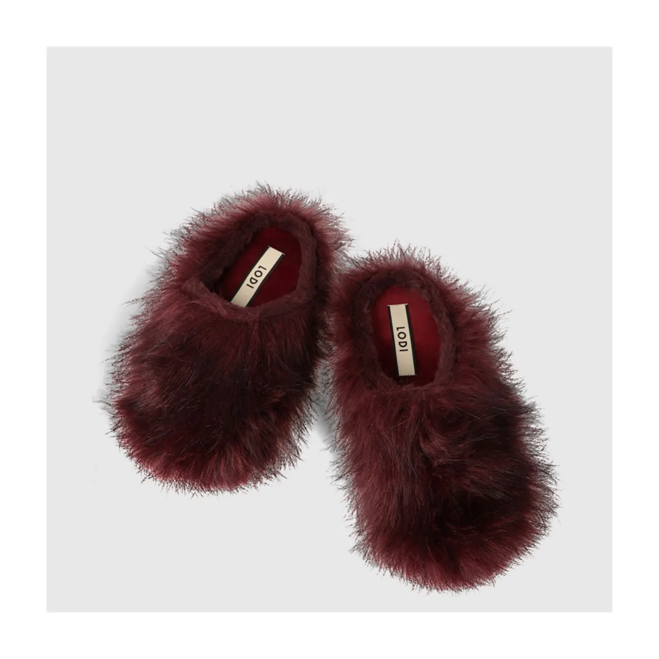 Zapatilla de casa destalonada de mujer con pelo de color burdeos. Suela flexible. | LODI zapatos de mujer online